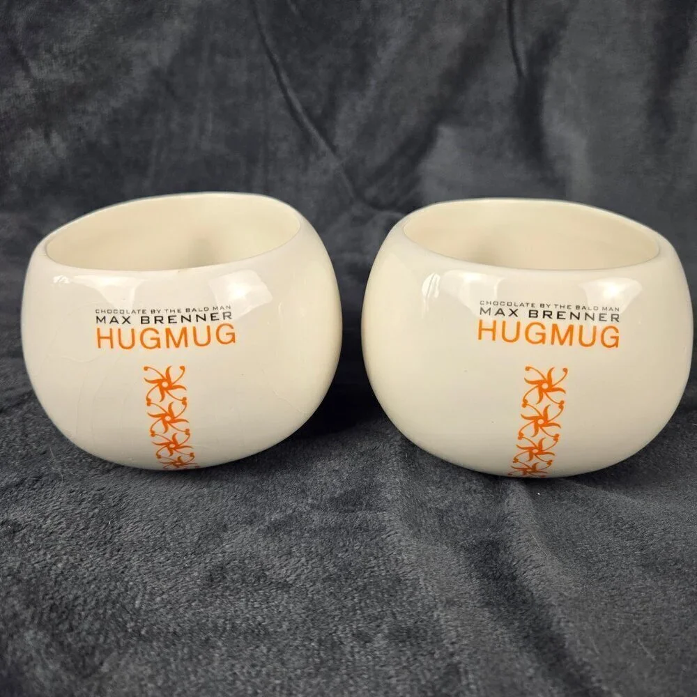 Pair of Chocolate by the Bald Man Max Brenner Hug Mugs White Ceramic